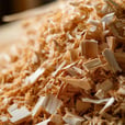 a close up image in a woodshop wood shavings